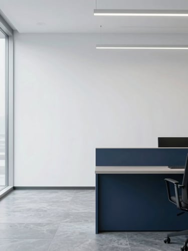 A bright, clean corporate office interior with modern minimalist lines, soft diffused daylight, cool slate gray and navy accents, negative space on the left, 35mm lens.