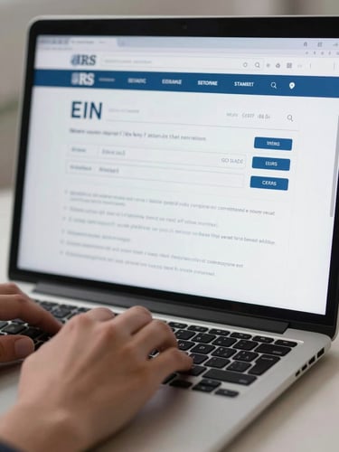 Close-up of a laptop screen displaying an EIN confirmation page from the IRS website, hands resting on keyboard, cool studio lighting, shallow depth of field, clean desk surface visible at bottom edge