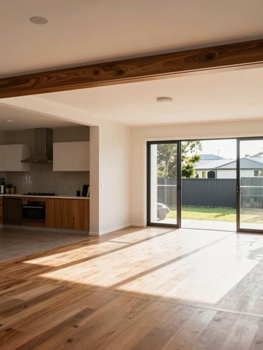 Before and after shot of a Brisbane home's living area, showing a dramatic transformation from a dark, closed-off space to a bright, open-plan layout, warm Australian daylight, shot from the exact same angle.