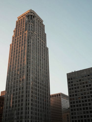 Quiet, architectural detail of San Francisco financial district high-rises under soft, indirect morning light with generous sky and negative space.