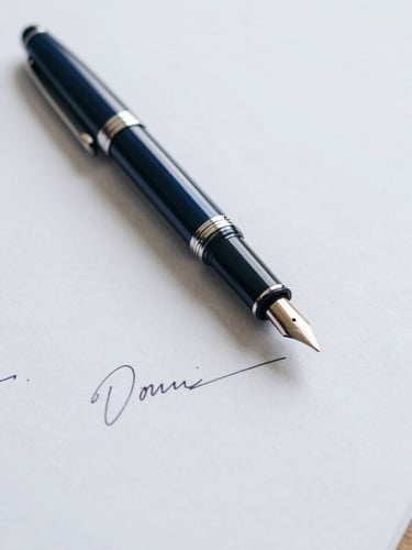Close-up of a fountain pen resting on a signed legal document, textured heavy paper, soft diffused overcast daylight, 50mm lens