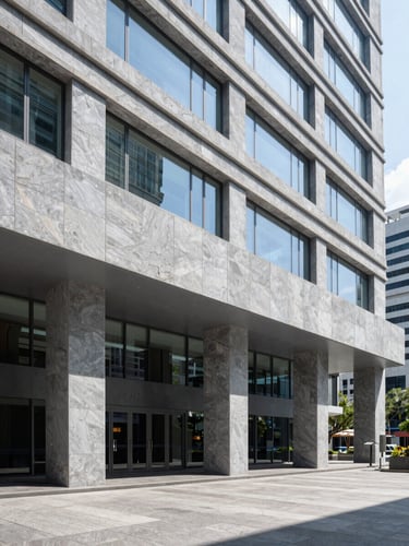 Modern corporate office building lobby in Mexico City, clean architectural lines, bright natural daylight, cool slate gray tones, sharp focus.