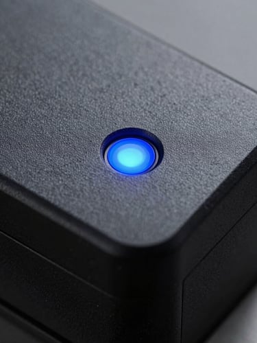 Macro close-up of an enterprise hardware security module, matte black casing with a single glowing blue status indicator, clean industrial design, sharp focus, cool studio lighting.