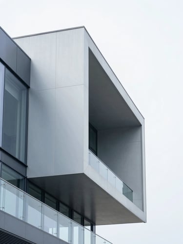Modern minimalist architectural structure with sharp steel and glass angles, bright overcast daylight, cool blue accents, 35mm corporate photography