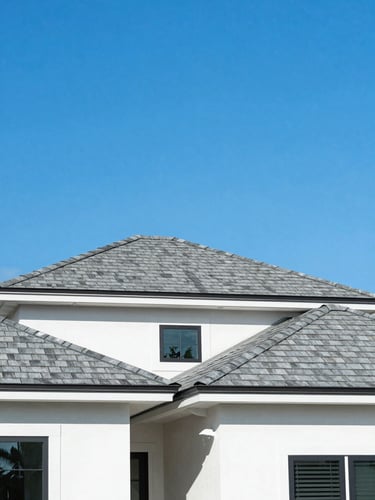 Bright architectural photography of a modern Florida home with a perfect new shingle roof under a vivid sunny blue sky, crisp daylight, 35mm lens