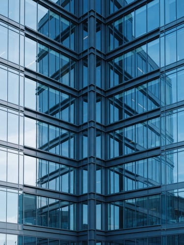 Symmetrical modern architectural detail of a corporate headquarters facade, clean glass and steel lines, crisp natural daylight with cool blue undertones, 35mm photography