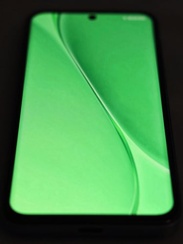 Extreme macro close-up of a premium Android device screen displaying a vibrant neon green fluid UI transition, low-key dramatic studio lighting, 35mm
