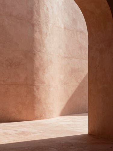 Minimalist architectural interior with a curved concrete wall, soft shadows, warm terracotta and pinkish beige tones, elegant natural light, 35mm