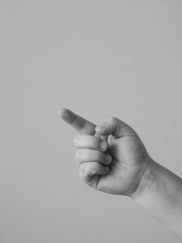 A close-up portrait of a baby's hands gently holding an adult finger, soft diffused studio light, minimalist black and white, clean gray backdrop, medium format film