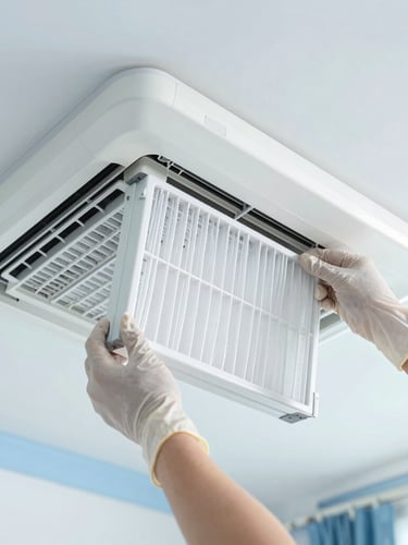 Close-up of clean hands wearing protective gloves installing a pristine white air filter into a modern sleek indoor unit, bright natural daylight, cool tones