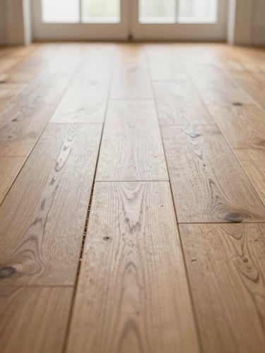Low-angle macro shot of perfectly aligned oak hardwood flooring planks, showing tight, seamless joints under bright natural window light, dust-free and clean.