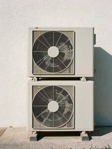 Symmetrical portrait framing of a perfectly leveled outdoor condenser unit against a clean stucco wall, bright natural Florida daylight, crisp shadows.
