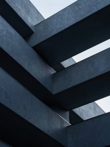 Sleek editorial photography of abstract architectural geometry with clean lines and sharp angles, cool low-key corporate lighting, deep navy and slate tones, sharp focus, 35mm