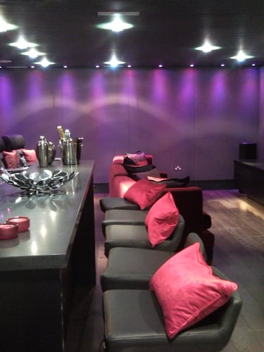 Fabric wall finish in a residential media room and home cinema
