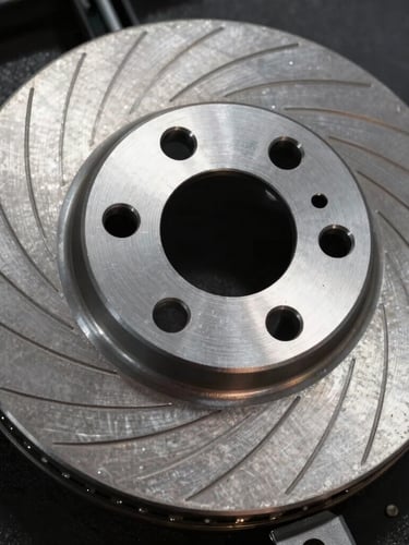 Extreme close-up of a high-performance ventilated brake disc made of machined steel, showing precise radial grooves and metallic grain, dramatic side-lighting on a dark textured background.