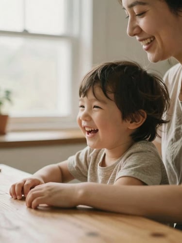 Close-up of a mother and child laughing together at a wooden kitchen table, warm morning window light, soft focus, cozy earth tones, 35mm