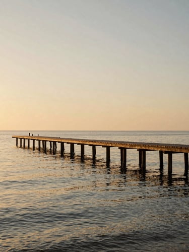 Cinematic side-angle view of a wooden pier stretching into the calm Mar Menor lagoon at sunrise, soft golden light reflecting off the water, clean horizon.