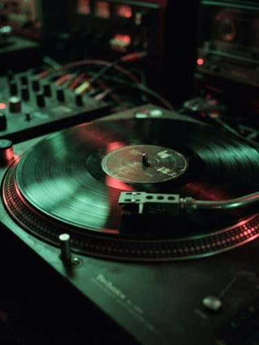 Close-up of a vinyl record spinning on a turntable in a dark basement studio, moody green neon lighting, 35mm grain, high contrast shadows