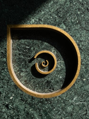 Macro close-up of a golden ratio spiral carved into dark green marble, sharp architectural shadows, direct sunlight, 35mm