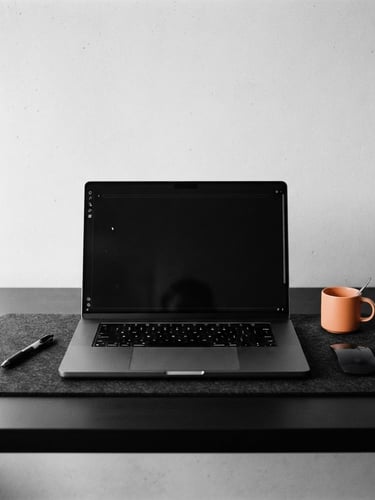 Minimalist workspace detail, sharp studio light, high-contrast monochrome with subtle orange accents, clean composition, 50mm