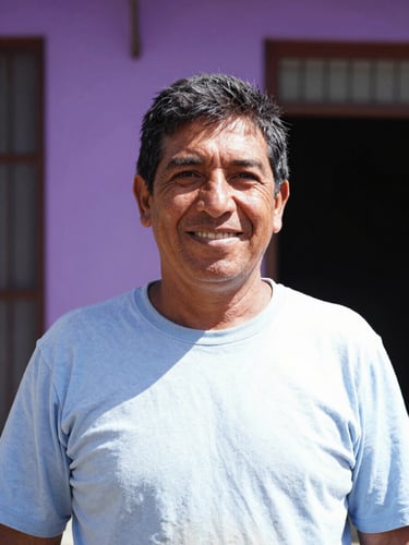 Environmental portrait of a friendly Argentine worker smiling, bright natural daylight, vibrant violet background details, outdoor setting, shallow depth of field, 35mm