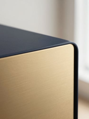 Extreme close-up of a premium tactile object, brushed gold and dark steel, soft natural light, minimalist composition, 35mm lens.