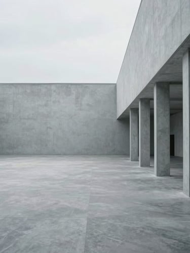 Wide off-center environmental composition of a serene, uncrowded architectural workspace, soft diffused overcast daylight, massive negative space on the left, cool gray tones.