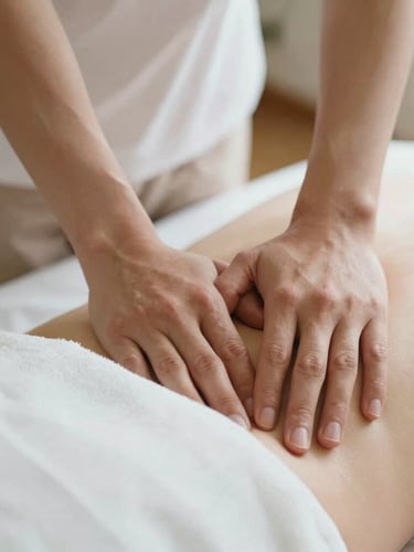 Close-up of professional therapist hands performing targeted deep tissue muscle therapy on clean white linen, soft diffused natural light, warm neutral tones