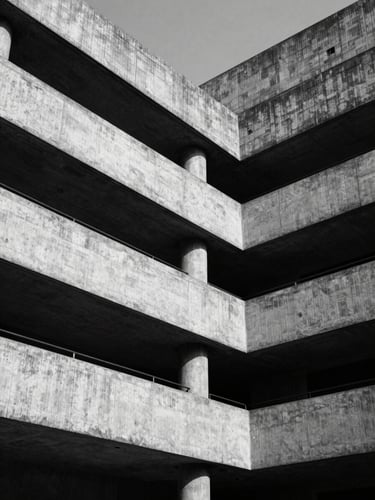 Low-angle stark monochrome shot of modern brutalist concrete court building in New Delhi, sharp geometric shadows, high-contrast directional light