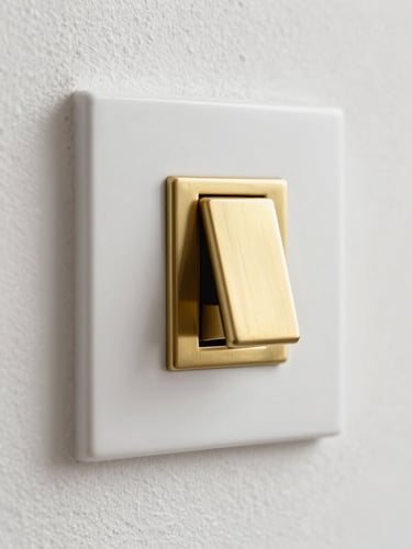 Macro detail shot of a solid brass light switch mounted on a textured plaster wall, soft side lighting, bright architectural photography, 35mm