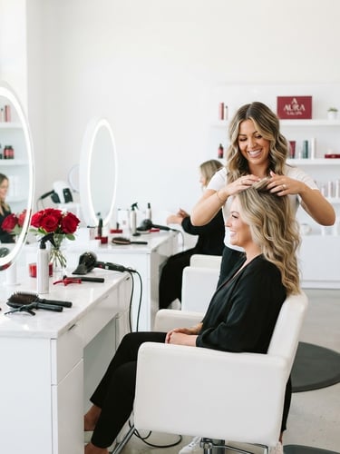 Bright editorial beauty photography of a modern, clean salon interior, high-key studio lighting with pristine white workstations and subtle crimson accents, 85mm portrait lens.