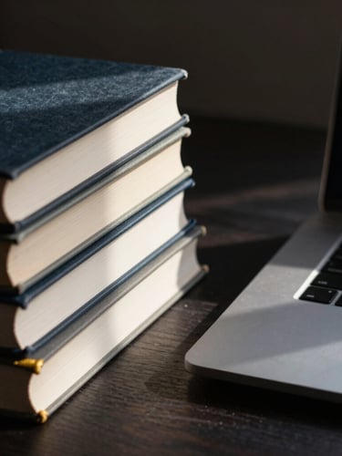A dark, high-contrast macro photograph of a structured workspace, displaying physical academic books stacked neatly next to a modern high-end laptop, soft directional daylight casting sharp clean shadows, gold accents subtly visible.