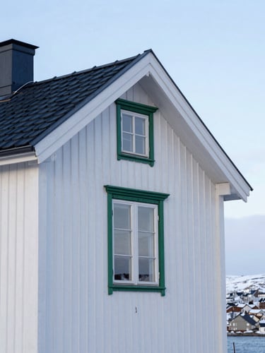 Crisp outdoor photography of a traditional wooden house in Vadsø, soft morning Arctic light, clean Scandinavian tones, deep blue accents, 35mm