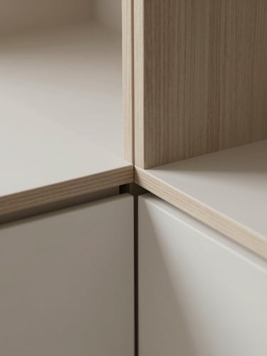 Close-up of perfectly aligned cabinet joints, oak veneer meeting matte MDF with millimeter precision, soft diffused daylight casting subtle shadows, 35mm lens
