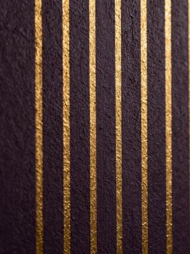 Extreme close-up of vertical print precision, showing crisp gold ink lines on a dark textured plaster wall, dramatic side-lighting.
