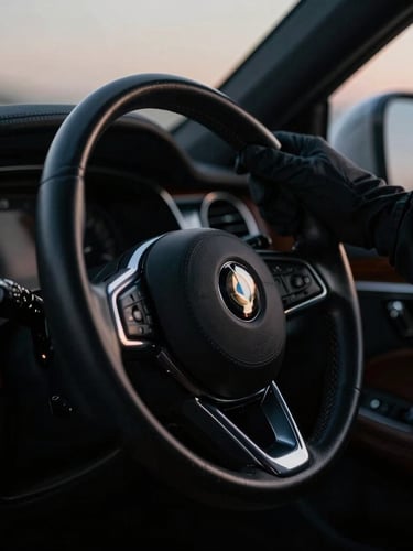 Gloved hand on a leather-wrapped steering wheel inside a pristine luxury vehicle cabin, soft twilight reflections on polished wood trim, cinematic lighting.