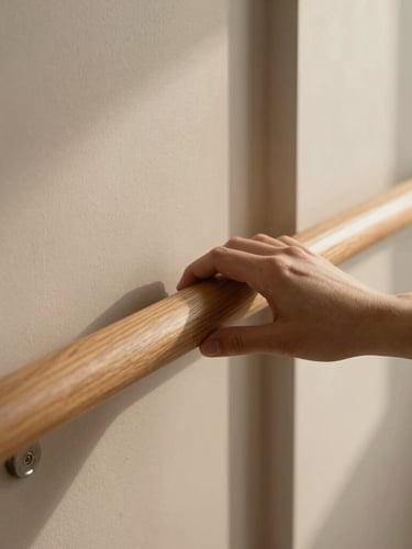 Close-up of premium interior materials, a hand touching a polished oak handrail, warm natural light, focus on tactile texture.
