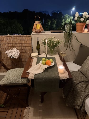 Cozy balcony with warm ambient lighting and natural wooden textures, inspired by warm European outdoor living