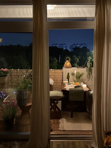 Cozy balcony with warm ambient lighting and natural wooden textures, inspired by warm European outdoor living