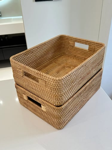 Natural woven storage basket for keeping cat toys organized and reducing visual clutter at home.