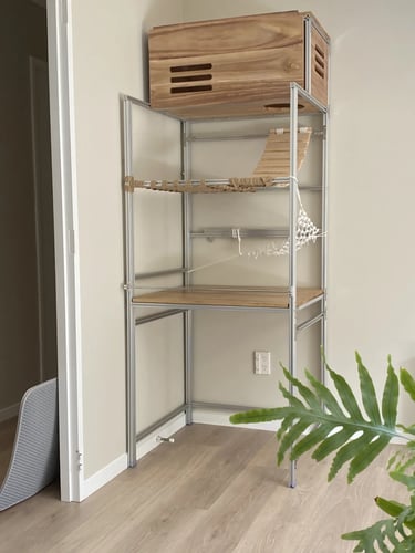 Minimal cat furniture shelf with storage, hammock and hidden pet areas for organizing cat essentials