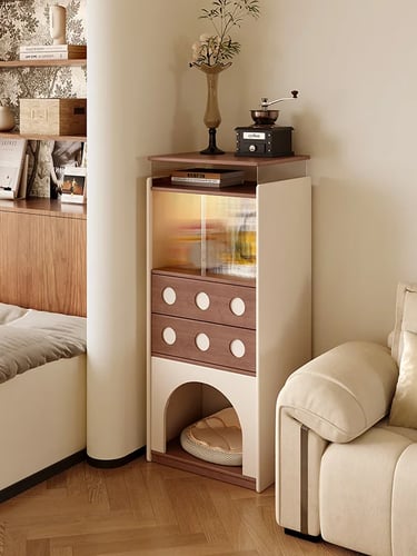 Furniture-style cat cabinet with a rounded entrance, storage drawers and calm neutral colors beside 