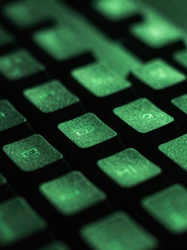 Macro photo of a mechanical keyboard under intense green neon lighting, high-contrast dark shadows, shallow depth of field, 35mm