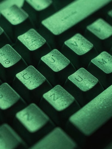 Macro shot of a mechanical keyboard under dramatic neon green light, high-contrast shadows, 35mm photography