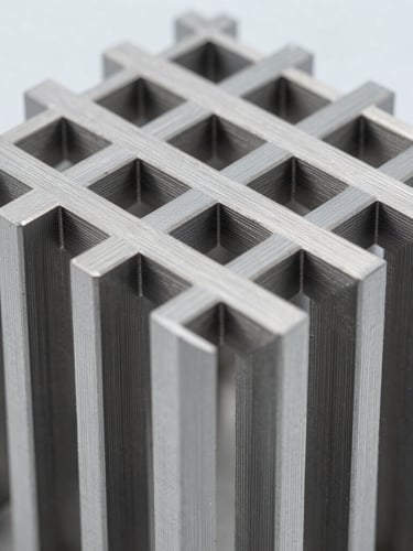 Macro close-up of a 3D-printed metal lattice structure, highly detailed titanium struts, clinical cleanroom lighting, cool metallic gray tones.