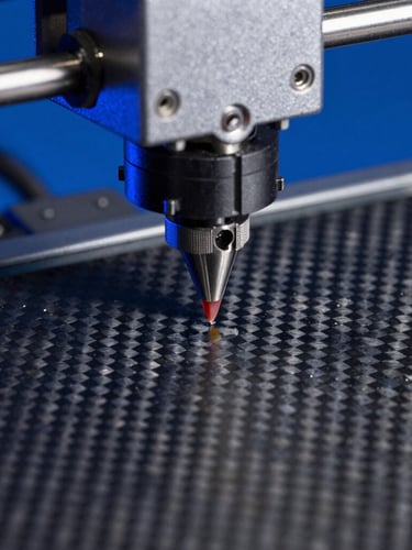 Extreme macro close-up of a 3D printer nozzle depositing a precise layer of carbon-fiber filament under sharp blue studio lighting, high contrast, technical texture.
