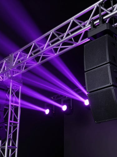 Close-up of state-of-the-art stage production equipment, intricate aluminum trusses, heavy audio arrays, illuminated by sharp purple lasers, dark studio environment.