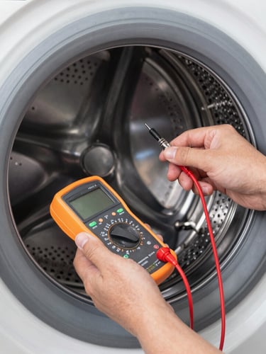 Close-up shot of a professional technician's hands using a digital multimeter to test the electrical contacts of a modern washing machine drum, bright clean utility lighting.