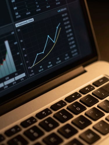 Macro close-up of a high-end laptop screen displaying clean analytics graphs, dramatic low-key lighting with warm golden highlights, premium editorial photography, 35mm