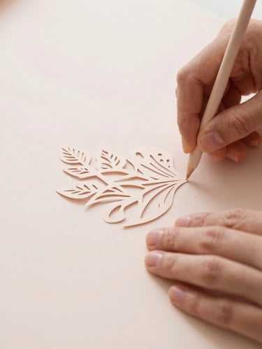 Close-up of hands carefully weeding excess vinyl from a delicate paper cut design on a light-colored mat, soft diffused daylight, focus on precision, muted blush and beige tones.